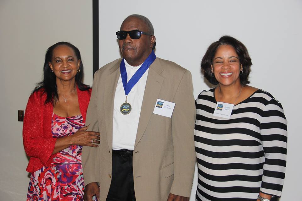 Larry McDowell standing with Bobbie Howard Davis and Michelle Levy